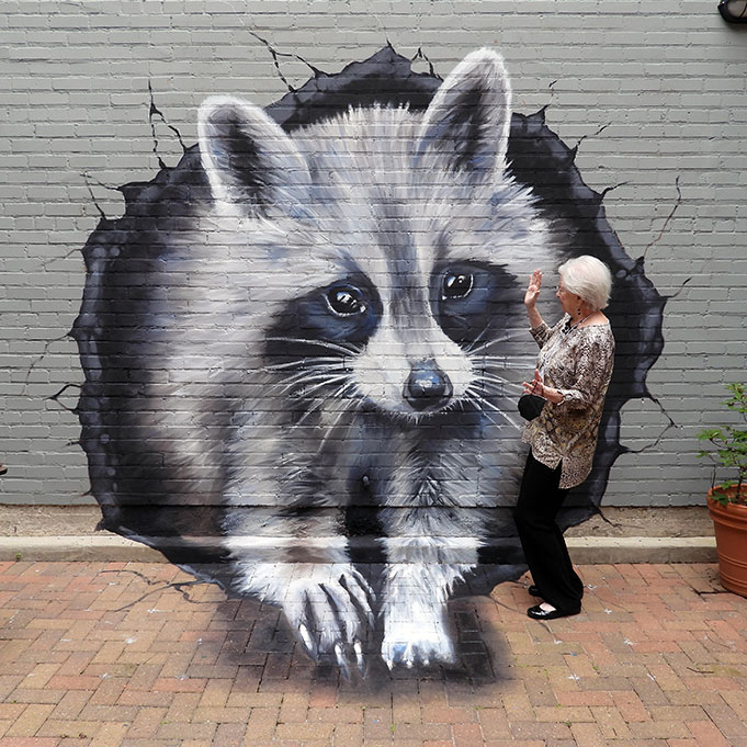 A 3D photo-realistic art piece of a raccoon by Anat Ronen